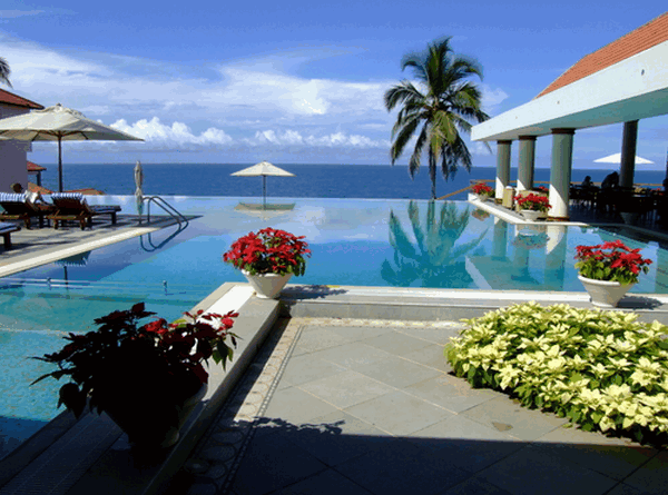 An infinity pool with a view at the Leela, Kovalam