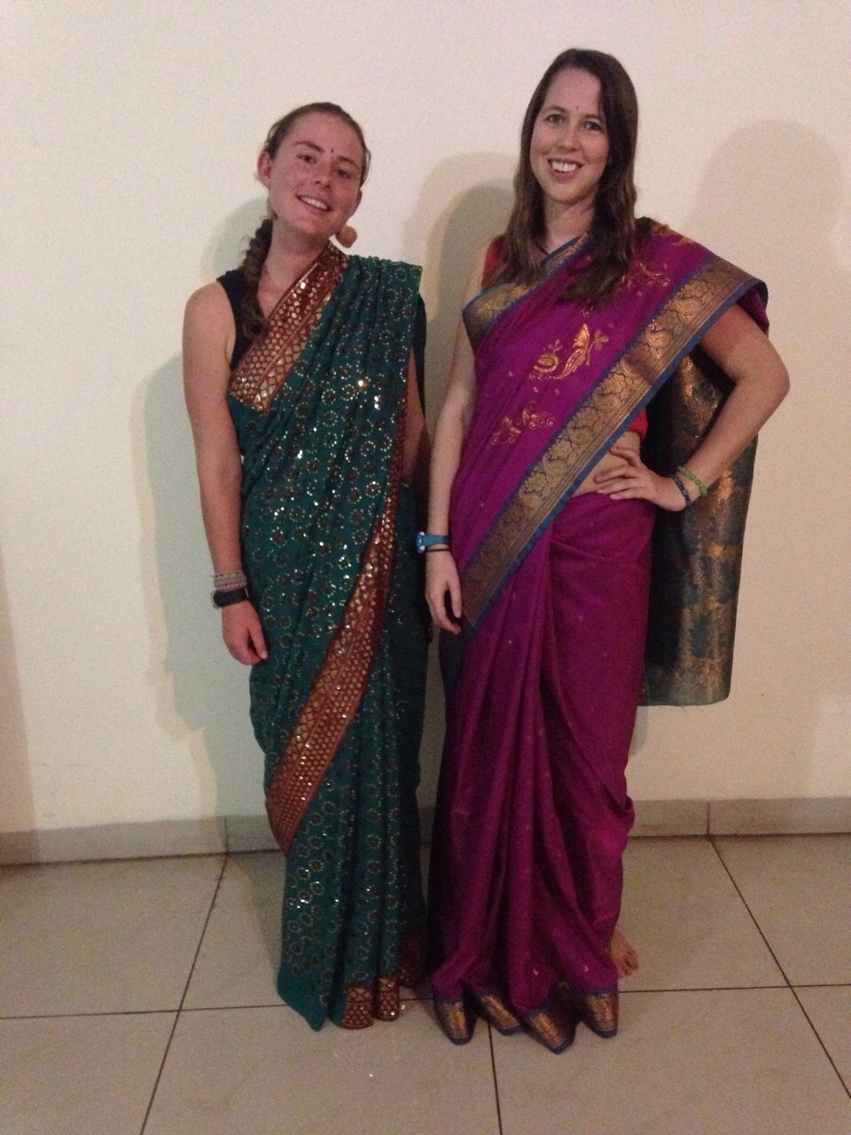 Having fun with another volunteer trying on saris in the apartment