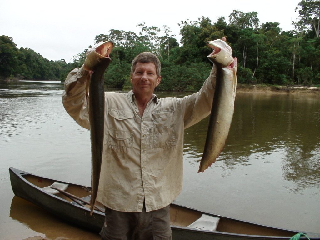 holding up two arowana 2