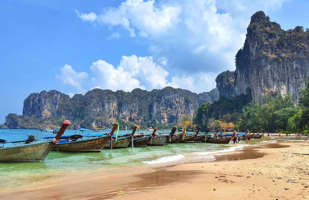 longtail boats and limestone rocks at Railay beach west, krabi, thailand